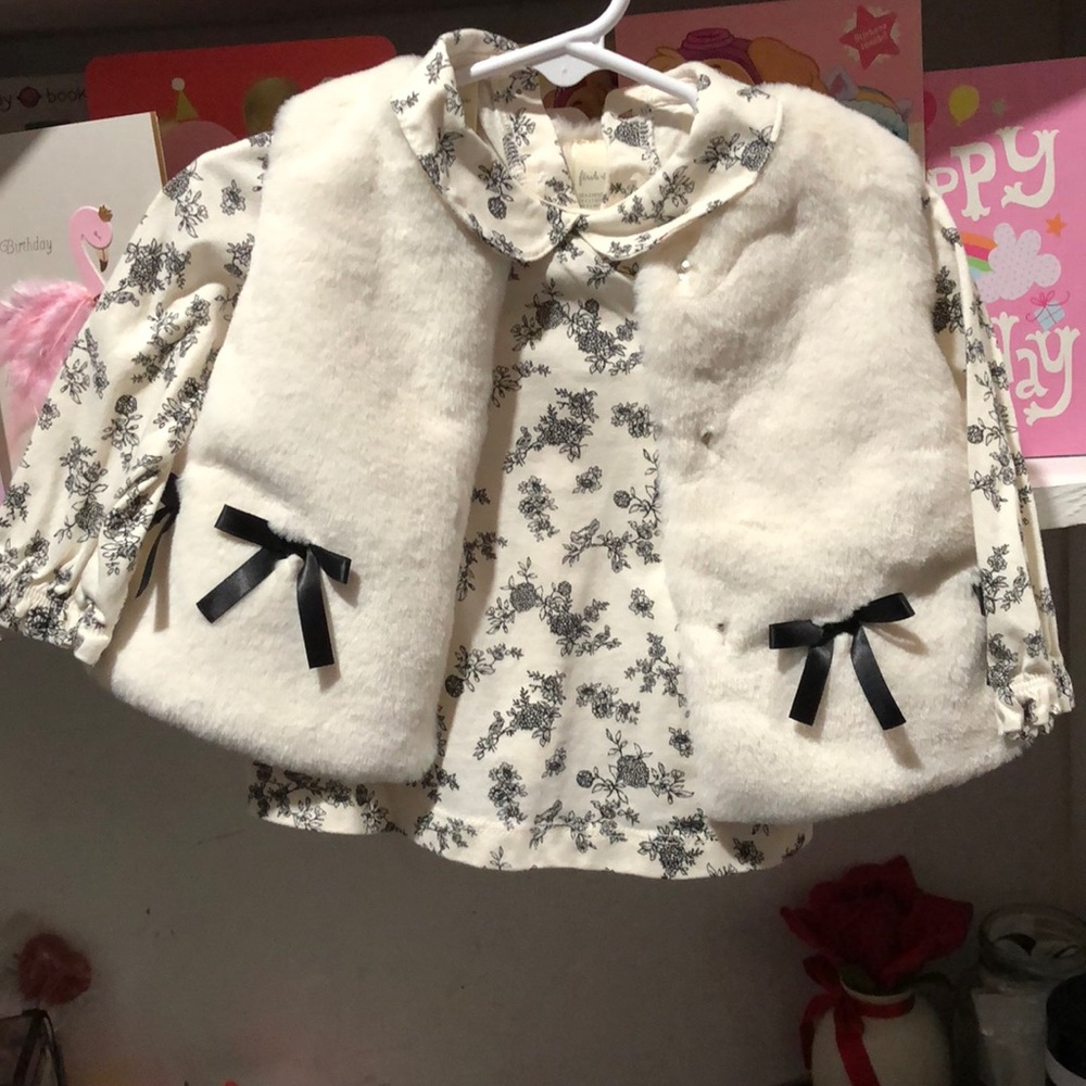 Two piece long sleeve shirt with a faux fur vest